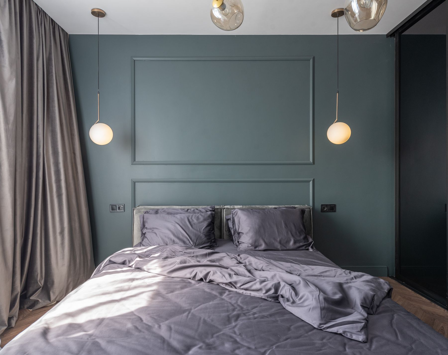 Calm bedroom with a bed beside a curtained window