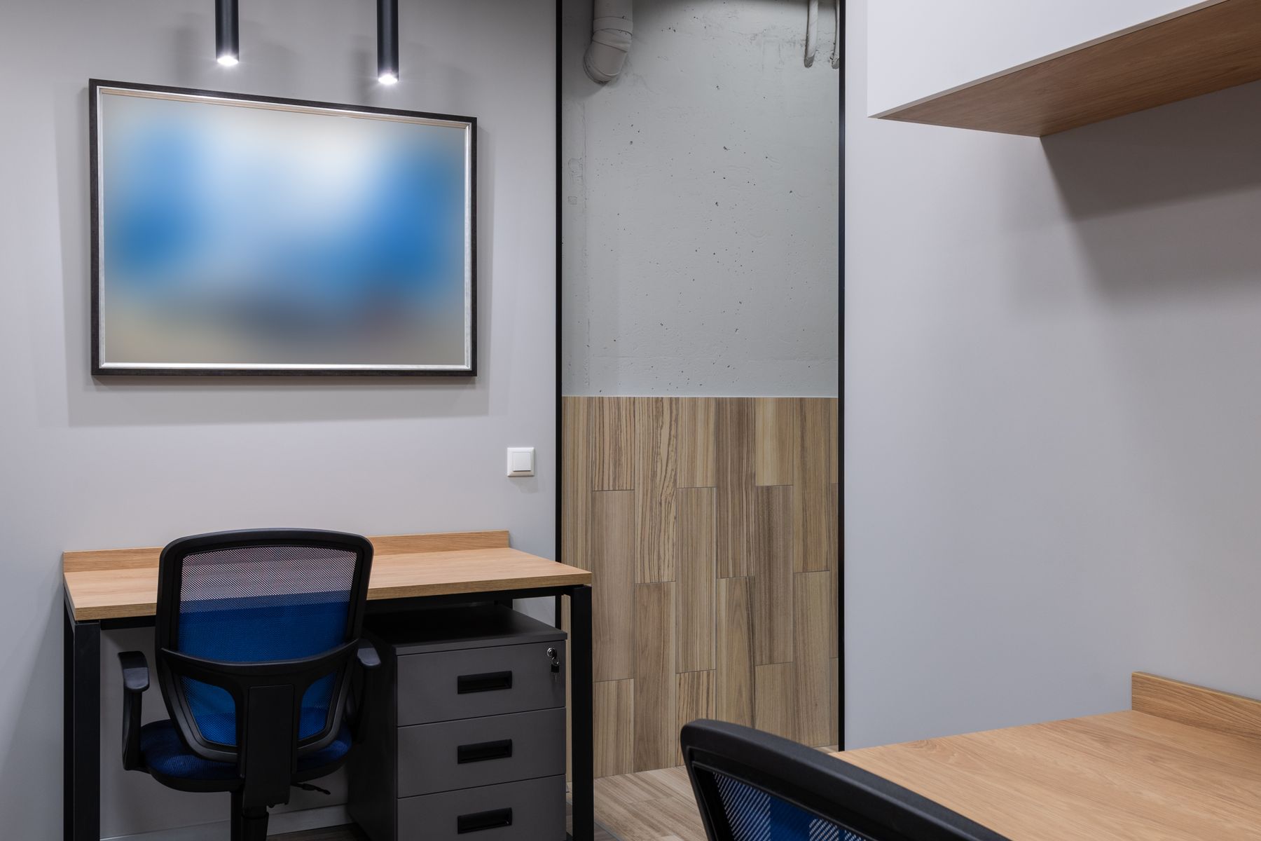 Bright modern office with rows of empty desks
